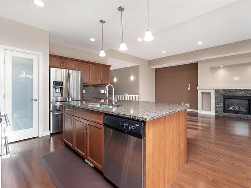 633 Cantor Landing, Edmonton, AB - Indoor Photo Showing Kitchen With Fireplace With Double Sink With Upgraded Kitchen