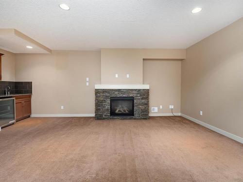 633 Cantor Landing, Edmonton, AB - Indoor Photo Showing Living Room With Fireplace