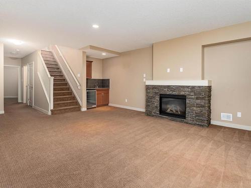 633 Cantor Landing, Edmonton, AB - Indoor Photo Showing Living Room With Fireplace