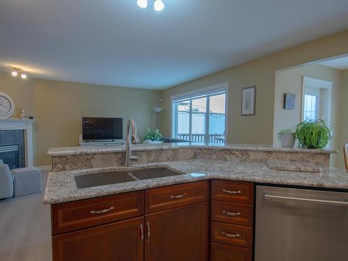 16724 119 Street, Edmonton, AB - Indoor Photo Showing Kitchen With Fireplace With Double Sink