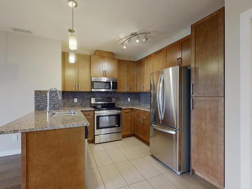 405 5151 Windermere Boulevard Sw, Edmonton, AB - Indoor Photo Showing Kitchen With Double Sink