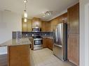 405 5151 Windermere Boulevard Sw, Edmonton, AB  - Indoor Photo Showing Kitchen With Double Sink 