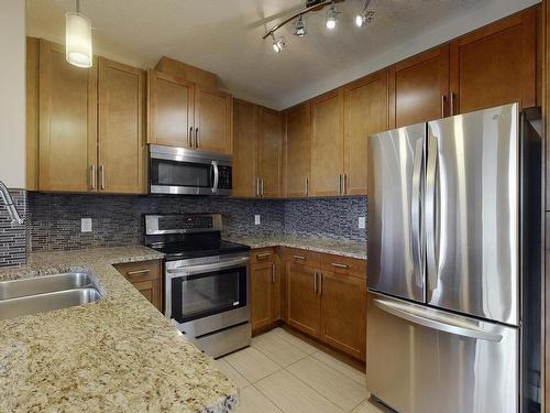 405 5151 Windermere Boulevard Sw, Edmonton, AB - Indoor Photo Showing Kitchen With Double Sink With Upgraded Kitchen