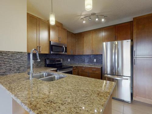 405 5151 Windermere Boulevard Sw, Edmonton, AB - Indoor Photo Showing Kitchen With Double Sink With Upgraded Kitchen