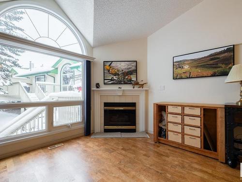 34 20 Ironwood Point(E), St. Albert, AB - Indoor Photo Showing Living Room With Fireplace