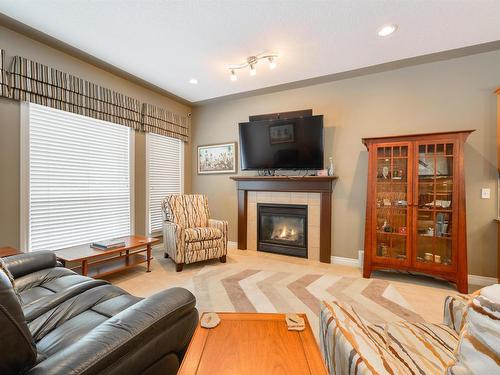 57 1225 Wanyandi Road, Edmonton, AB - Indoor Photo Showing Living Room With Fireplace