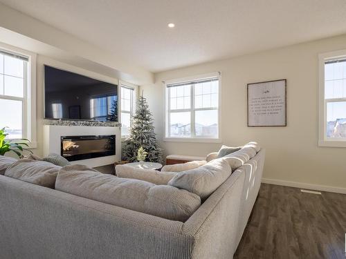 2208 8530 94 Street, Fort Saskatchewan, AB - Indoor Photo Showing Living Room With Fireplace