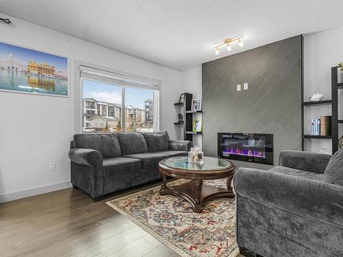 322 42 Ave Nw, Edmonton, AB - Indoor Photo Showing Living Room With Fireplace