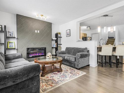 322 42 Ave Nw, Edmonton, AB - Indoor Photo Showing Living Room With Fireplace