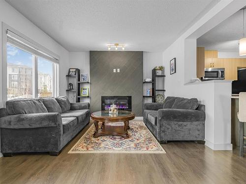 322 42 Ave Nw, Edmonton, AB - Indoor Photo Showing Living Room With Fireplace