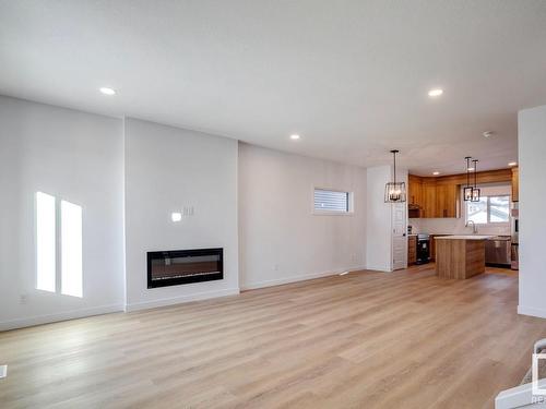 24 Tenor Link, Spruce Grove, AB - Indoor Photo Showing Other Room With Fireplace