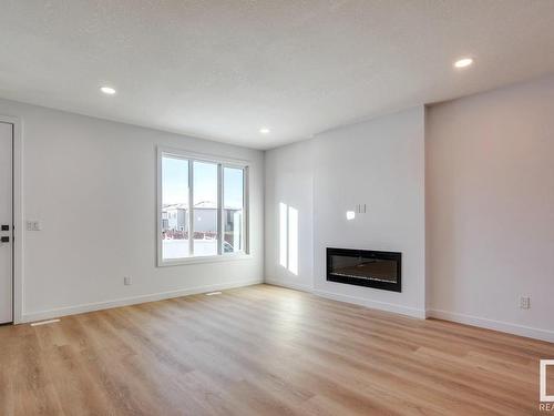 24 Tenor Link, Spruce Grove, AB - Indoor Photo Showing Living Room With Fireplace