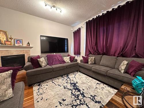 8711 10 Avenue, Edmonton, AB - Indoor Photo Showing Living Room With Fireplace