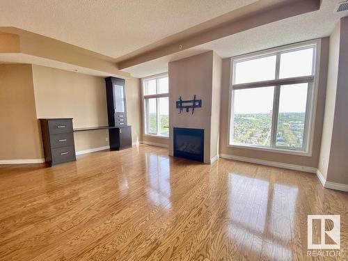 1506 9020 Jasper Avenue, Edmonton, AB - Indoor Photo Showing Living Room With Fireplace