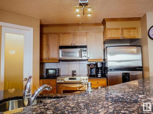 1506 9020 Jasper Avenue, Edmonton, AB - Indoor Photo Showing Kitchen With Double Sink