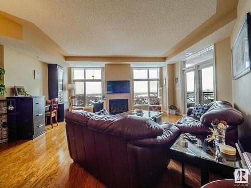 1506 9020 Jasper Avenue, Edmonton, AB - Indoor Photo Showing Living Room With Fireplace