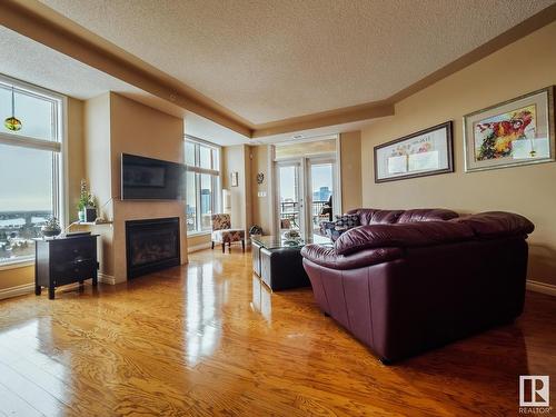 1506 9020 Jasper Avenue, Edmonton, AB - Indoor Photo Showing Living Room With Fireplace