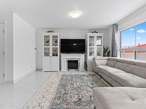 1947 51 Street, Edmonton, AB - Indoor Photo Showing Living Room With Fireplace