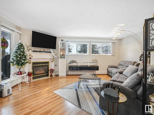 110 15499 Castle Downs Road, Edmonton, AB - Indoor Photo Showing Living Room With Fireplace