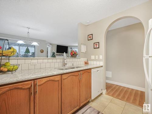 110 15499 Castle Downs Road, Edmonton, AB - Indoor Photo Showing Kitchen With Double Sink