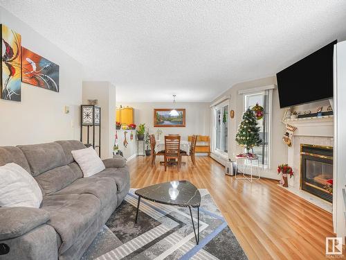 110 15499 Castle Downs Road, Edmonton, AB - Indoor Photo Showing Living Room With Fireplace