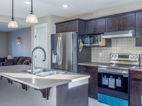 2159 Trumpeter Way, Edmonton, AB - Indoor Photo Showing Kitchen With Stainless Steel Kitchen With Double Sink With Upgraded Kitchen