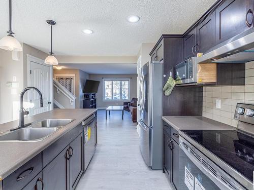 2159 Trumpeter Way, Edmonton, AB - Indoor Photo Showing Kitchen With Double Sink