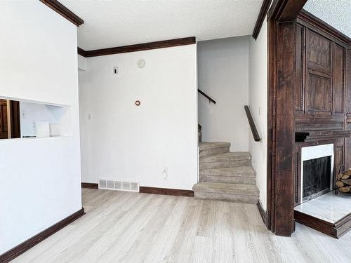 301 Lancaster Terrace, Edmonton, AB - Indoor Photo Showing Other Room With Fireplace