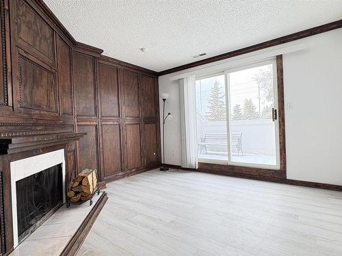 301 Lancaster Terrace, Edmonton, AB - Indoor Photo Showing Other Room With Fireplace