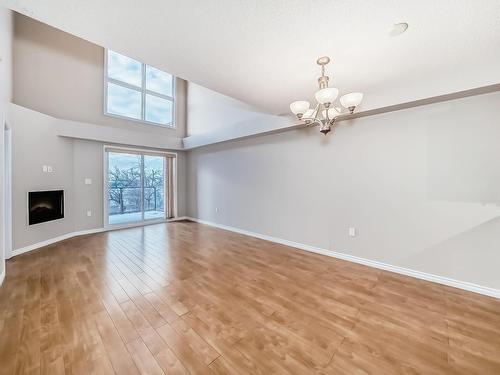 405 10118 106 Avenue, Edmonton, AB - Indoor Photo Showing Other Room With Fireplace