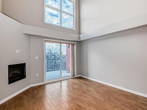 405 10118 106 Avenue, Edmonton, AB - Indoor Photo Showing Other Room With Fireplace