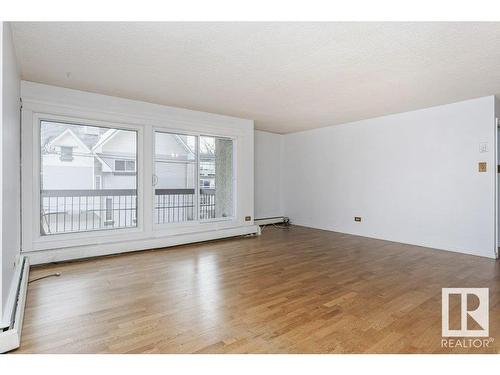 303 9737 112 Street, Edmonton, AB - Indoor Photo Showing Living Room