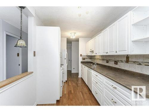 303 9737 112 Street, Edmonton, AB - Indoor Photo Showing Kitchen With Double Sink