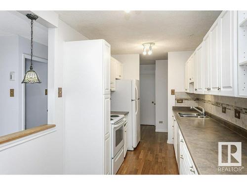 303 9737 112 Street, Edmonton, AB - Indoor Photo Showing Kitchen With Double Sink