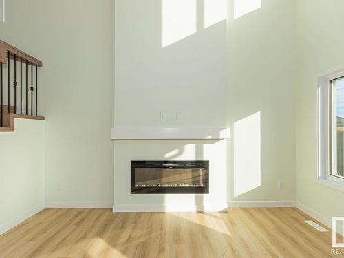 3619 41 Avenue, Beaumont, AB - Indoor Photo Showing Living Room With Fireplace