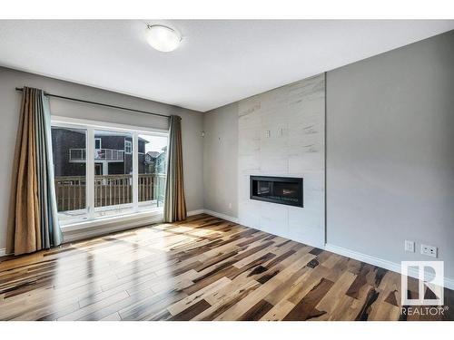 3159 Winspear Crescent, Edmonton, AB - Indoor Photo Showing Other Room With Fireplace