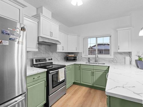 215 263 Macewan Road, Edmonton, AB - Indoor Photo Showing Kitchen With Double Sink