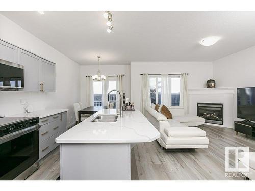 41 18230 104A Street, Edmonton, AB - Indoor Photo Showing Kitchen With Fireplace With Double Sink With Upgraded Kitchen