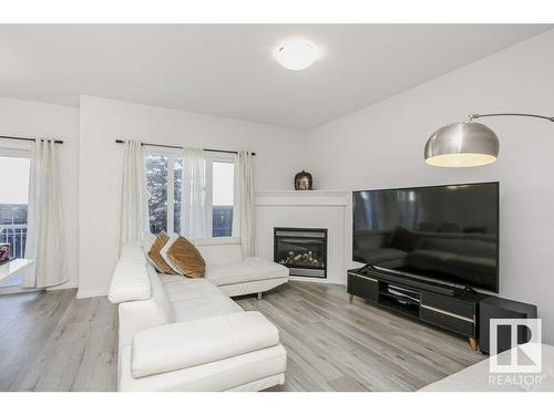 41 18230 104A Street, Edmonton, AB - Indoor Photo Showing Living Room With Fireplace