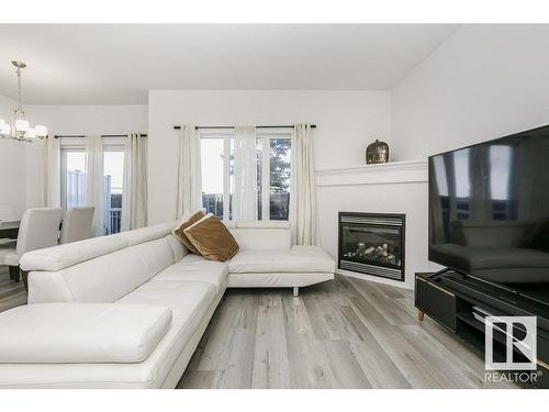 41 18230 104A Street, Edmonton, AB - Indoor Photo Showing Living Room With Fireplace