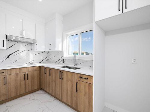 1415 11 Avenue, Edmonton, AB - Indoor Photo Showing Kitchen With Double Sink