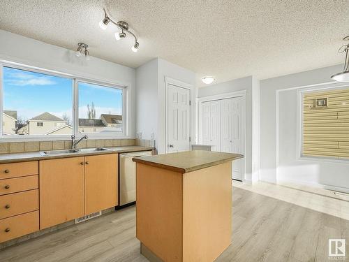 7706 15 Avenue, Edmonton, AB - Indoor Photo Showing Kitchen With Double Sink