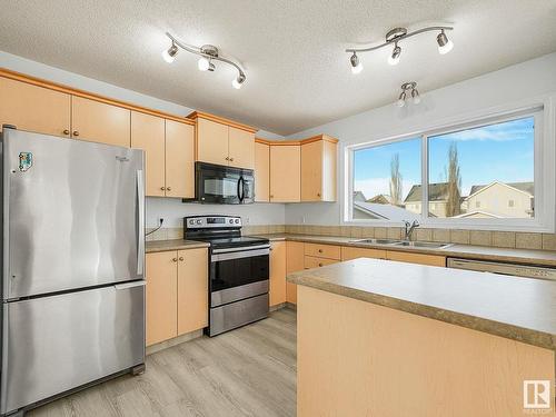 7706 15 Avenue, Edmonton, AB - Indoor Photo Showing Kitchen With Double Sink