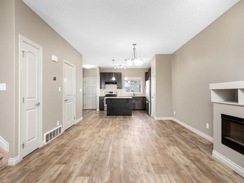 903 Morris Way, Leduc, AB - Indoor Photo Showing Living Room With Fireplace