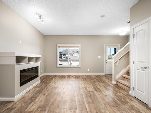 903 Morris Way, Leduc, AB - Indoor Photo Showing Living Room With Fireplace