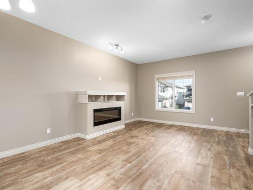 903 Morris Way, Leduc, AB - Indoor Photo Showing Living Room With Fireplace