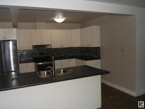 4901 47 Avenue, Myrnam, AB - Indoor Photo Showing Kitchen With Double Sink