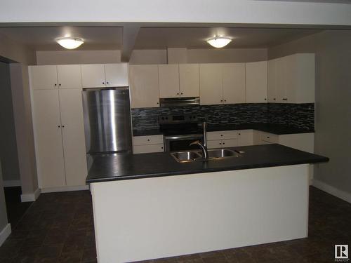 4901 47 Avenue, Myrnam, AB - Indoor Photo Showing Kitchen With Double Sink