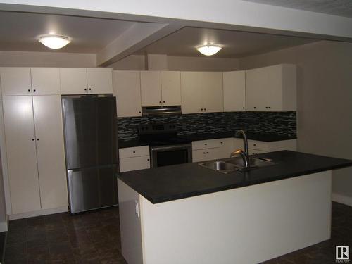 4901 47 Avenue, Myrnam, AB - Indoor Photo Showing Kitchen With Double Sink