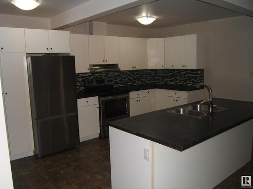 4901 47 Avenue, Myrnam, AB - Indoor Photo Showing Kitchen With Double Sink